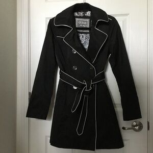 Guess black trench coat, size medium, with white piping trim along edges of coat